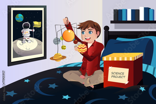 Boy making a solar system science project