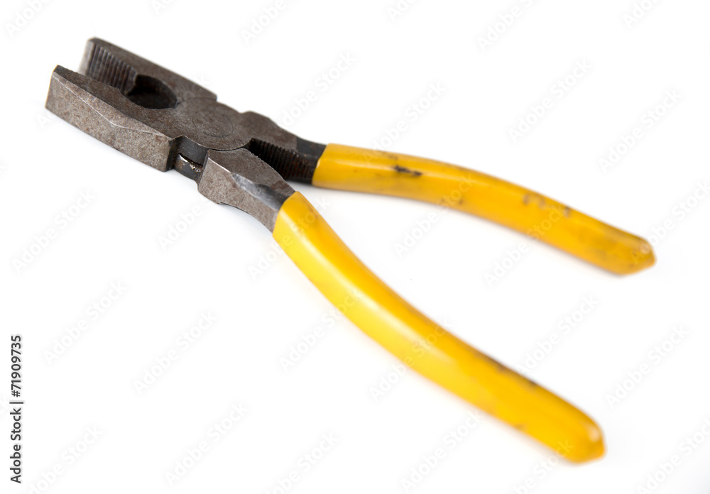Closeup of rusted metal pliers isolated against white Closeup of rusted metal pliers isolated against white