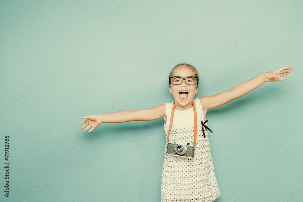 child holding a instant camera child holding a instant camera