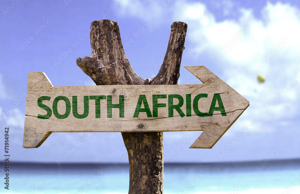 South Africa wooden sign with a beach on background