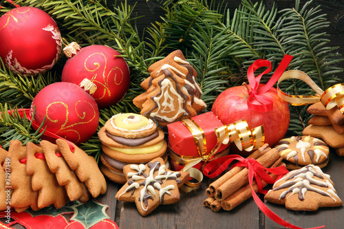 Christmas decoration with gingerbread cookies on wooden backgrou