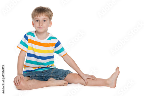 Little boy sits on the floor