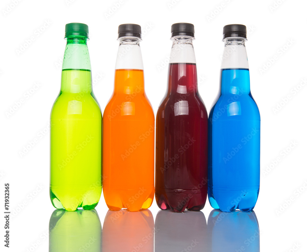 Multicolored soda drinks in bottles over white background Multicolored soda drinks in bottles over white background