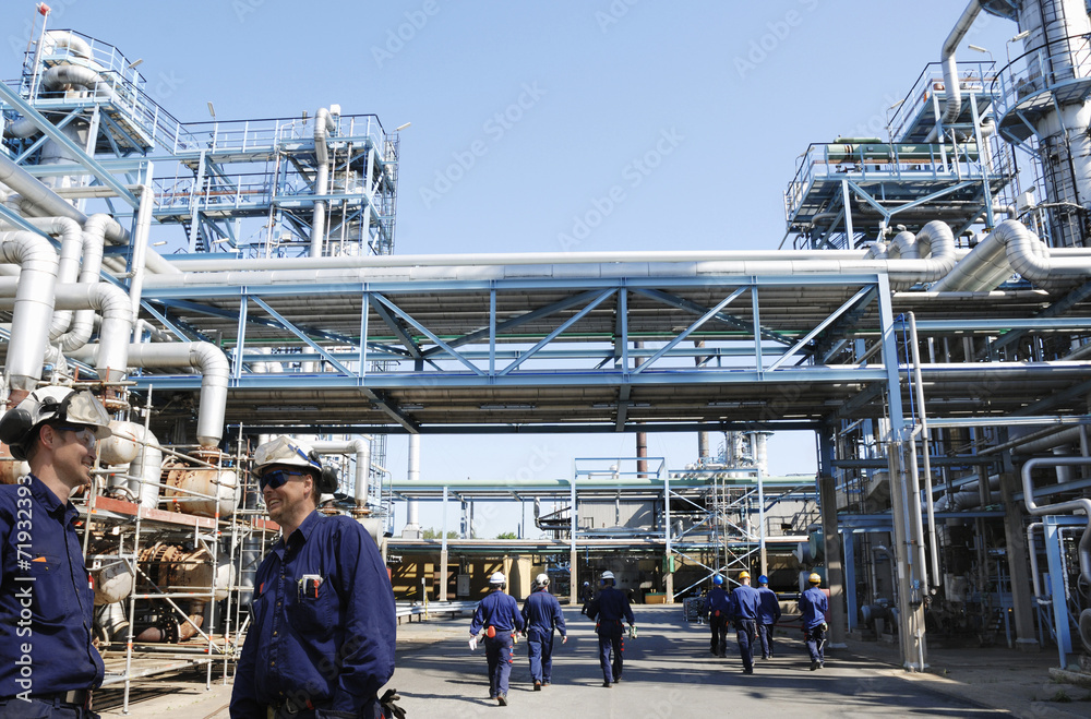 refinery workers in action, as seen inside the industry