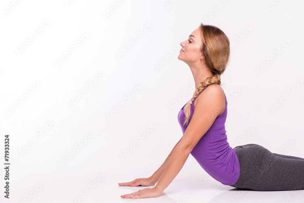 Healthy young sportswoman does the exercises Healthy young sportswoman does the exercises