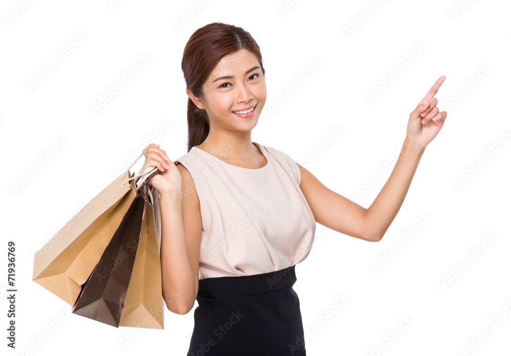 Happy woman with shopping bag and finger up