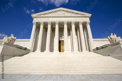 Supreme courthouse in Washington, blue sky behind. photo