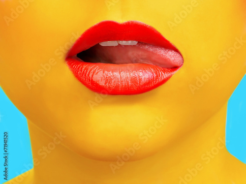 Close-up portrait of girl with yellow skin and red lips