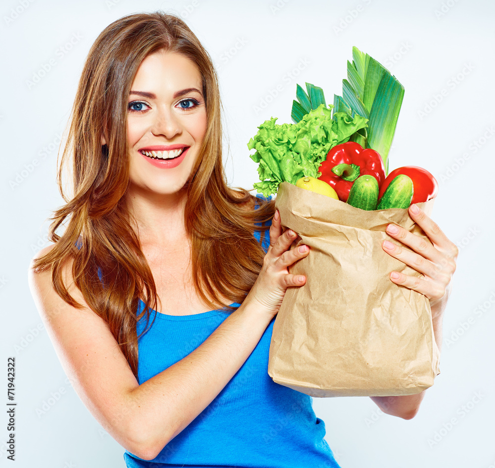 woman hold shopping bag with green vegan food woman hold shopping bag with green vegan food