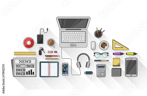 Overhead of desk with stationery and technology