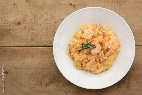 Risotto with shrimps, prosciutto and various vegetables