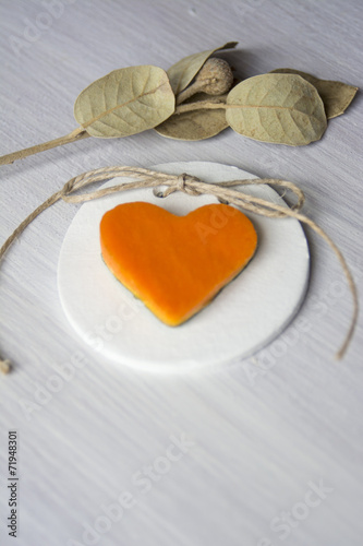 love halloween, heart pumpkin on white wooden background