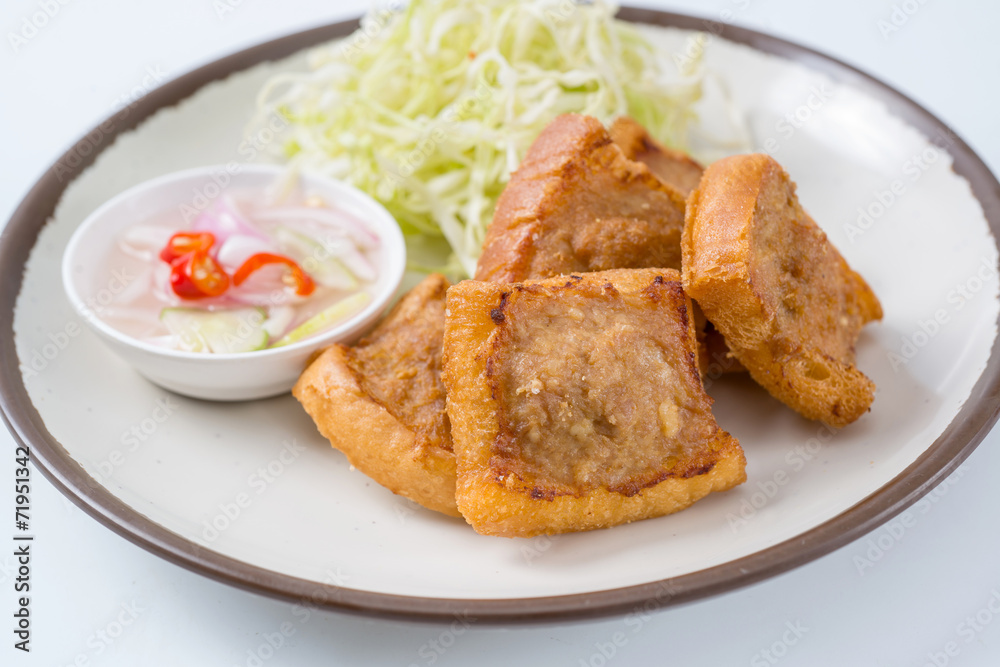 Roast pork with a side dish with a white background.