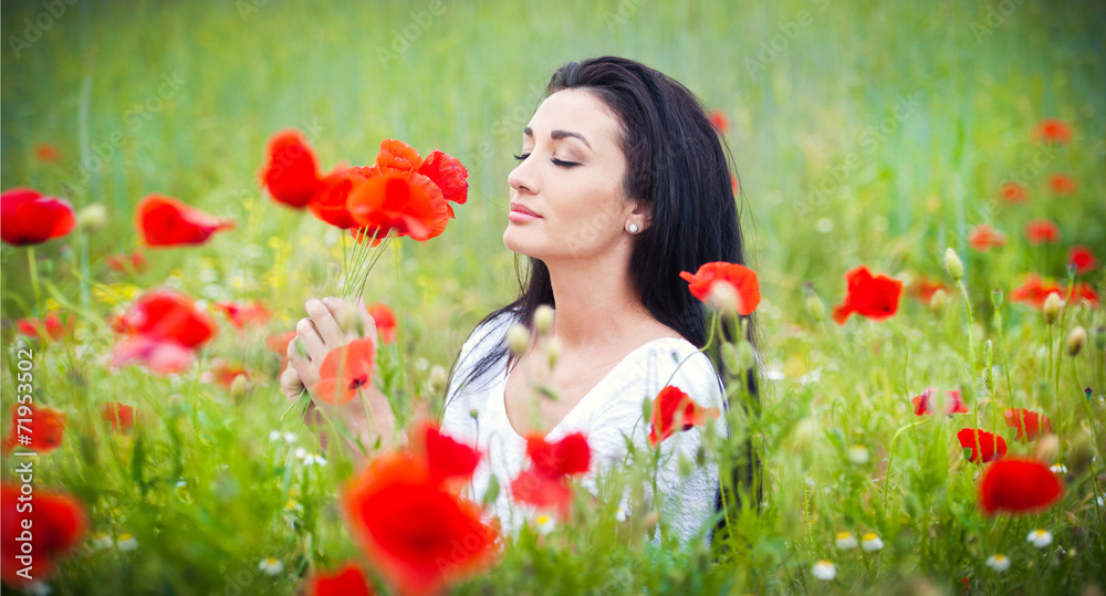 Young girl relaxing in green poppies field Young girl relaxing in green poppies field