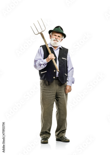 Valokuvatapetti Old man with pitchfork isolated