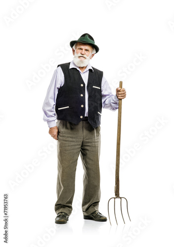 Fotografie Old man with pitchfork isolated