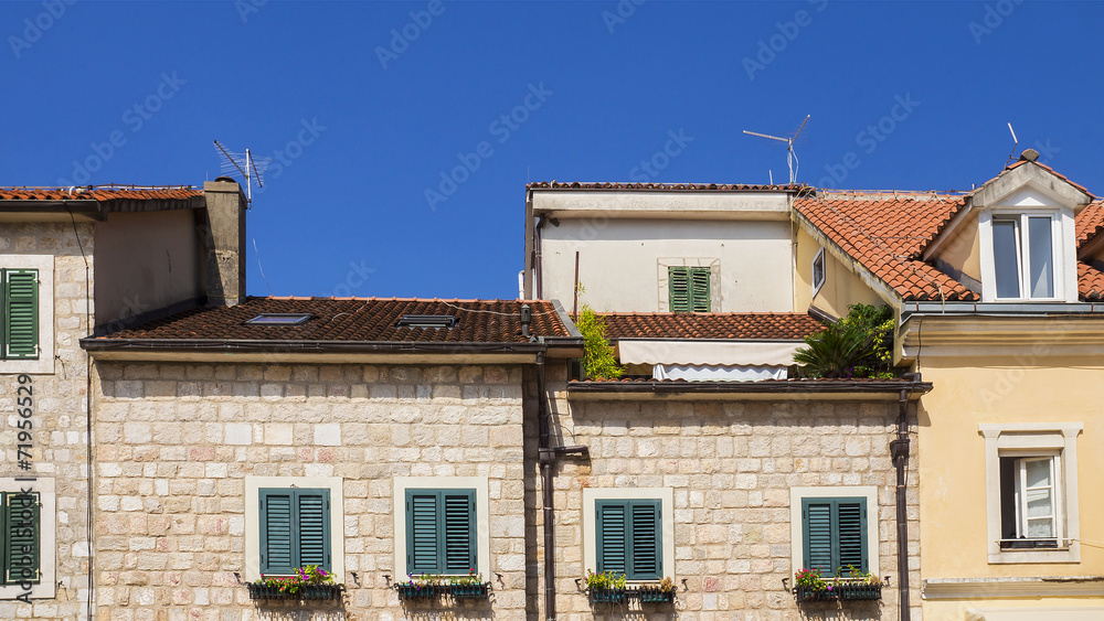 facade of an old house with a tiled roof