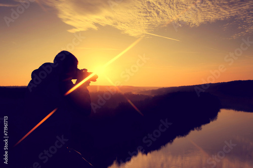 Photographer in the morning at sunrise