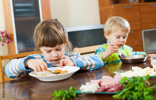 serious children eating food