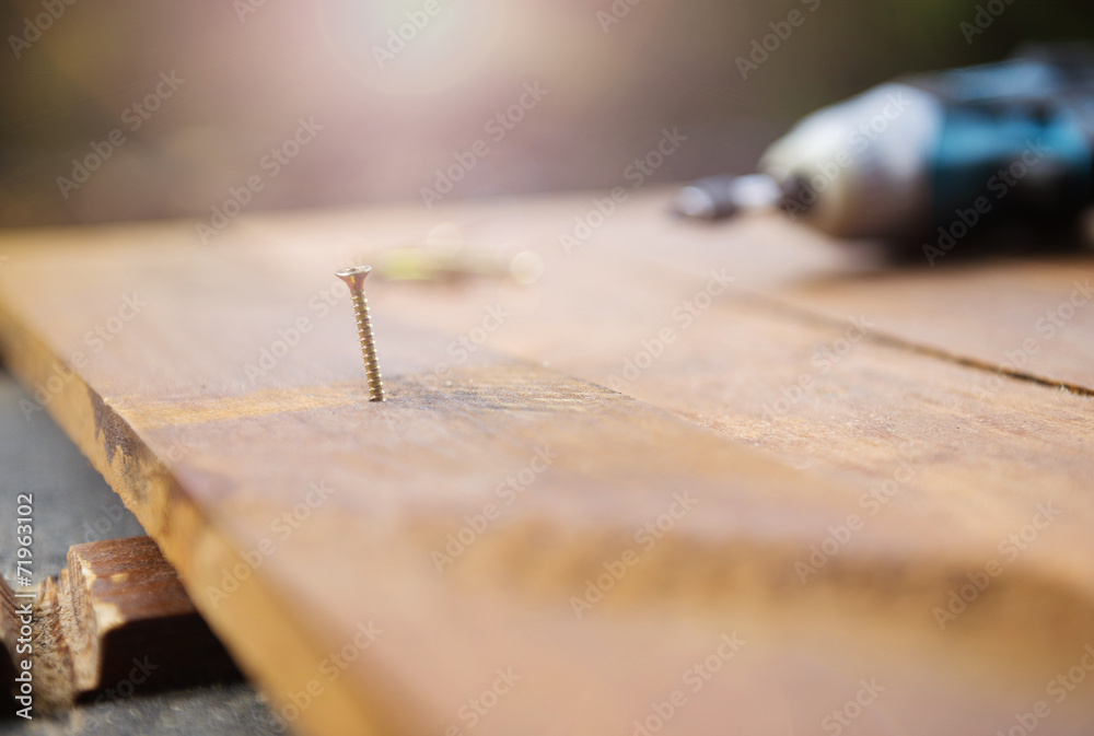 Drill left on wooden floor Drill left on wooden floor