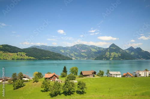 Layers of a Swiss: fields, lakes, mountains and blue sky
