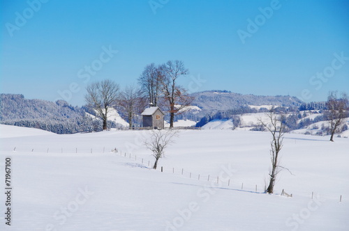 Chapel in winter landscape © flucas