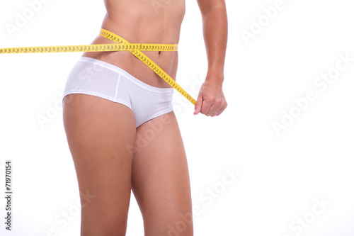 Mulher com Corpo saudável a Medir a Cintura photo