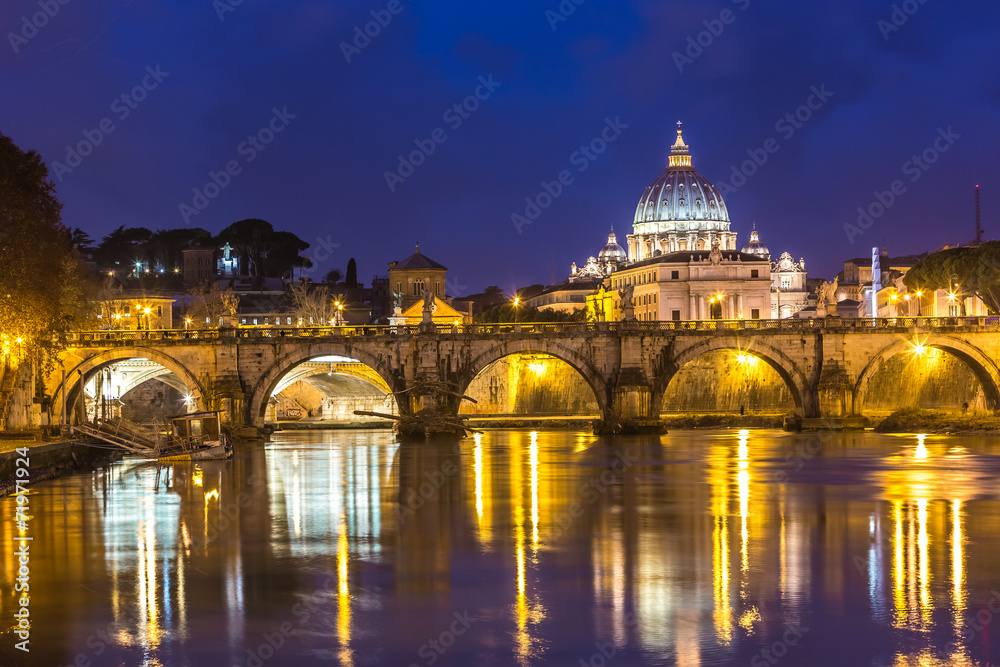 Vatican and river Tiber in Rome - Italy at night .