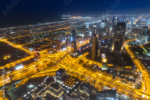 Dubai downtown night scene with city lights 