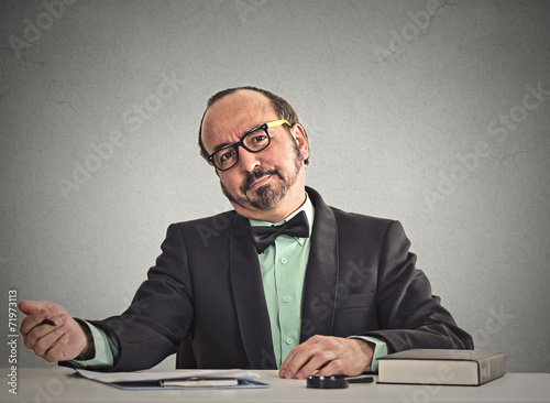 businessman skeptically looking at you during interview
