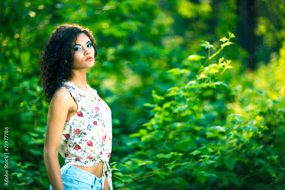 portrait of a beautiful blonde outdoors in the park