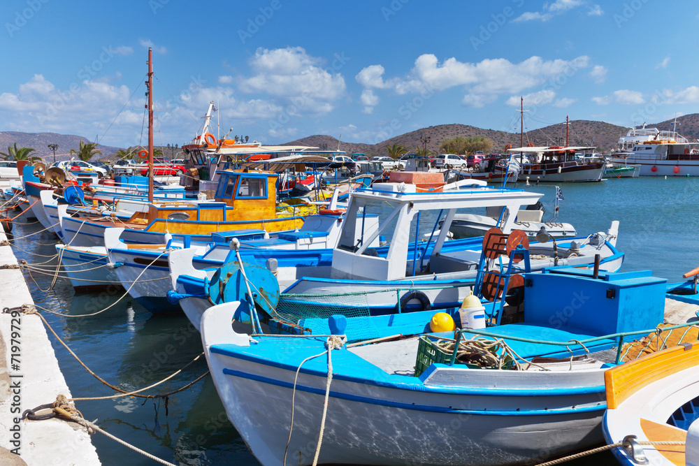 Greece. Crete. Fishing boats at Elounda in sunny day