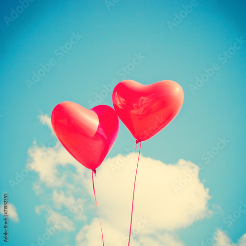 Two red heart-shaped balloons