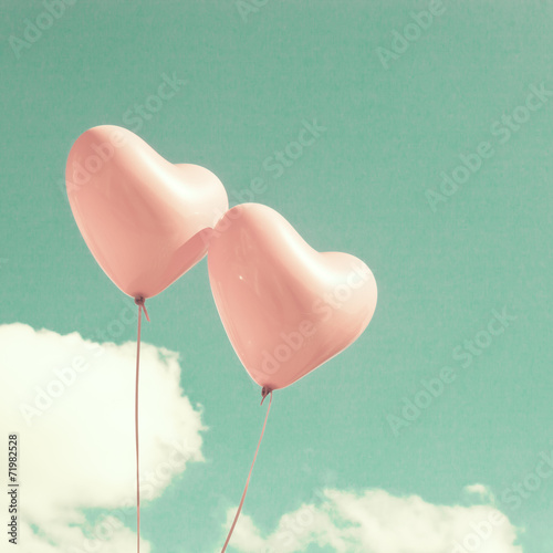 Two pink heart-shaped balloons