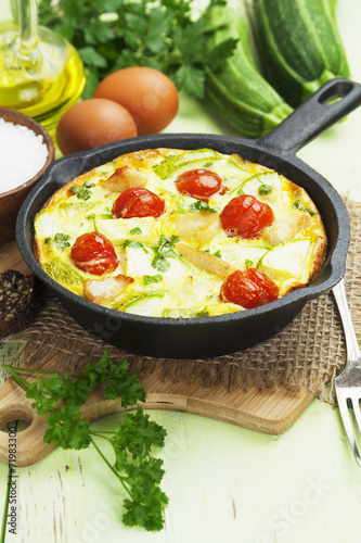 Zucchini baked with chicken, cherry tomatoes and herbs