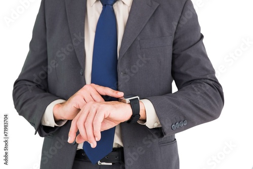 Businessman using his smart watch