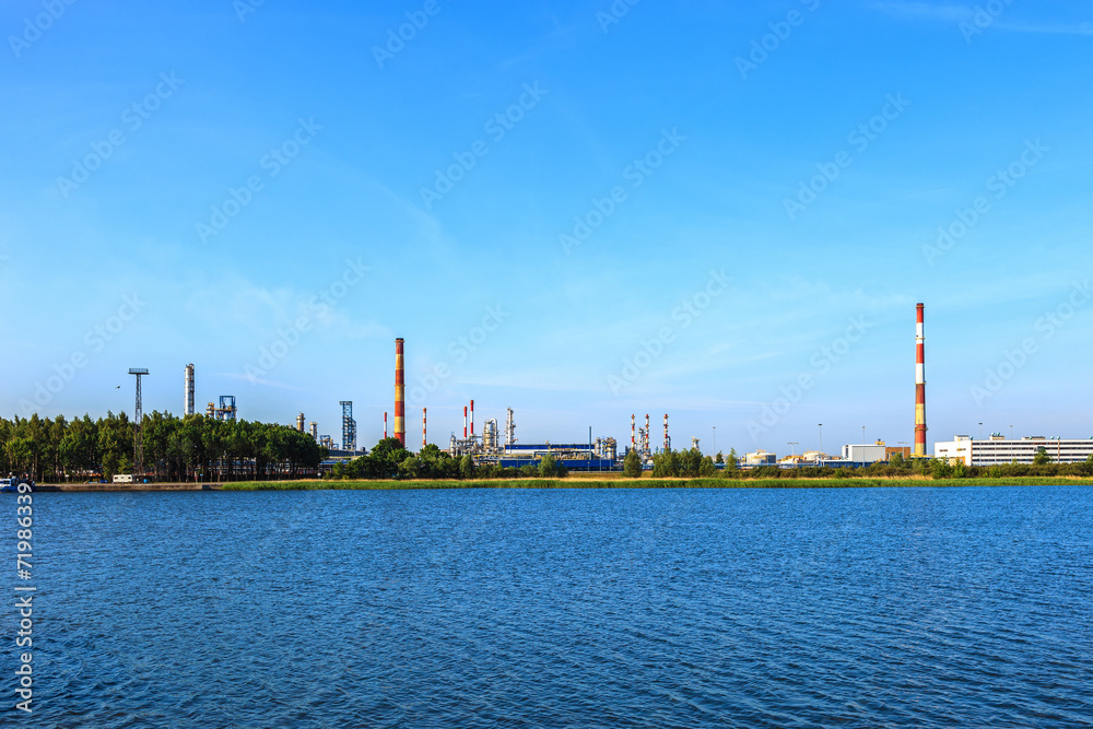 Landscape of river and oil refinery factory.