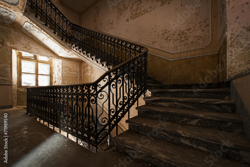Abandoned staircase and hidden creepy hand