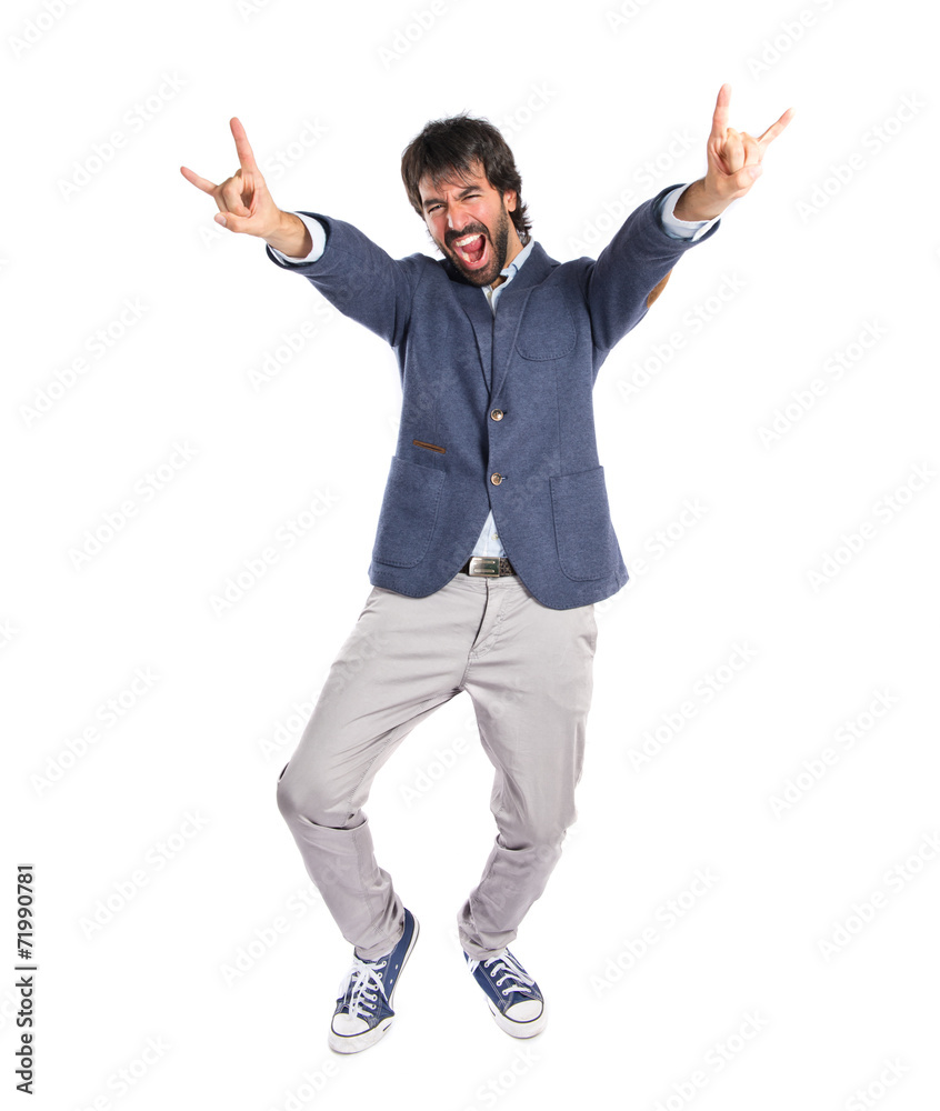 Man making horn gesture over white background Man making horn gesture over white background