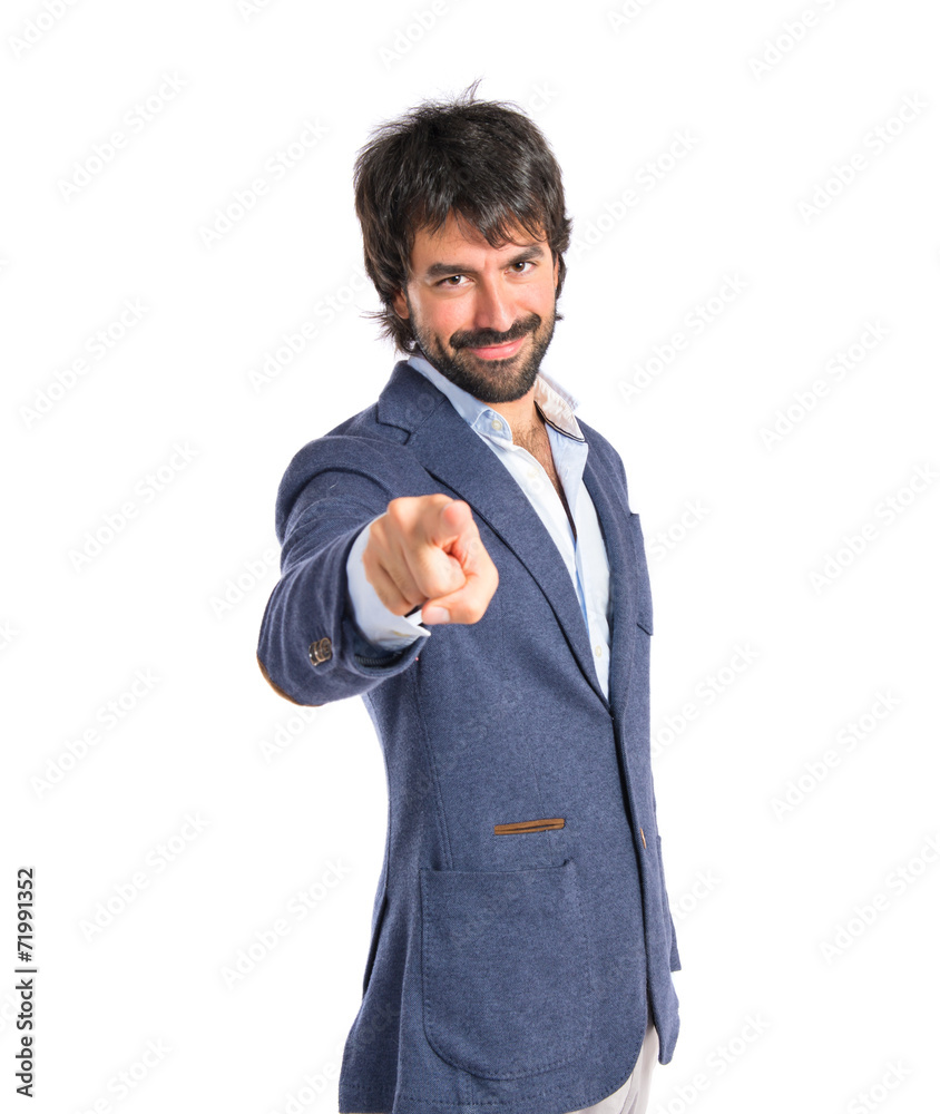 Man pointing to the front over white background Man pointing to the front over white background