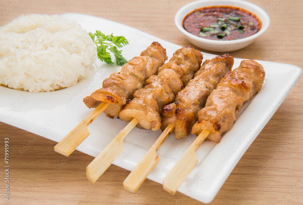 Grilled pork and sticky rice on plate, Thai food style Grilled pork and sticky rice on plate, Thai food style