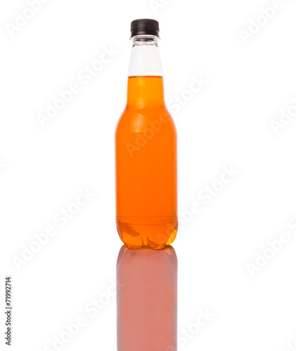 Orange colored soda drinks in bottles over white background 