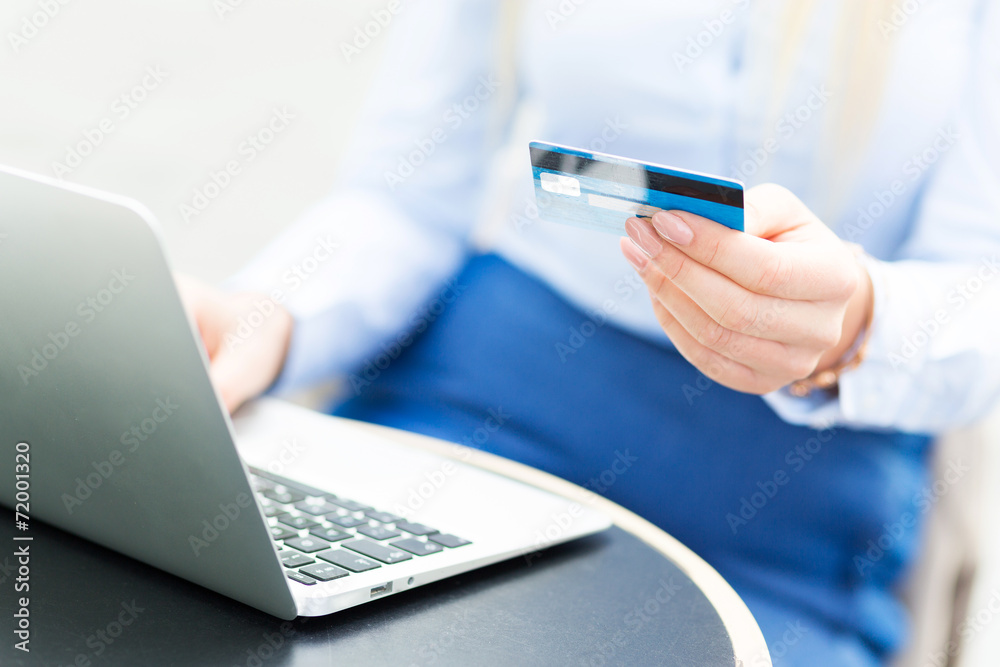 Woman with laptop and credit card Woman with laptop and credit card