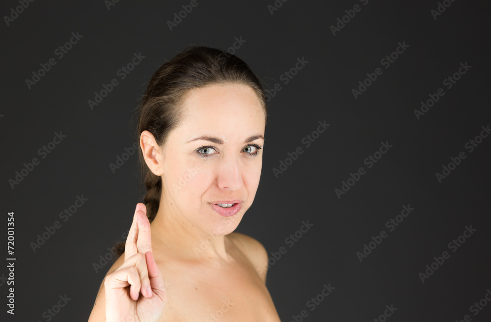 model isolated with fingers crossed for luck model isolated with fingers crossed for luck