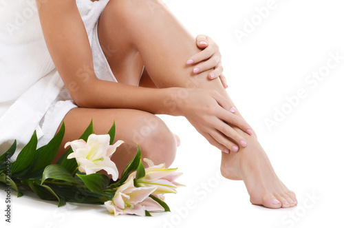 Female hands and feet with manicure and pedicure