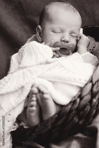 a lovely sleeping little newborn