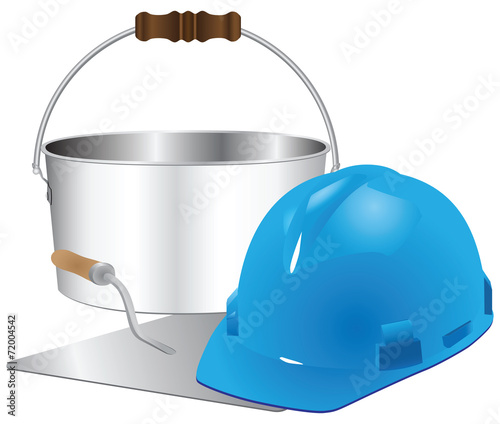 Helmet and trowel with bucket of cement