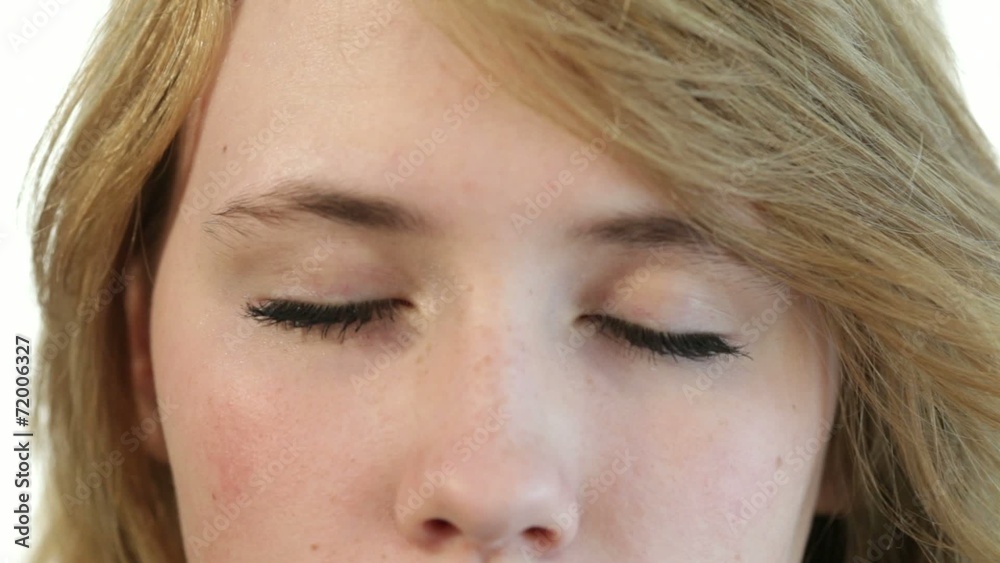 Closeup portrait to the head of a teenager girl, closed eyes, op Closeup portrait to the head of a teenager girl, closed eyes, op