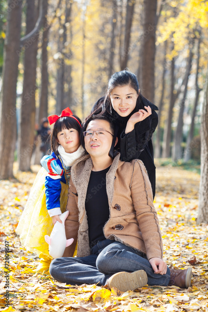 happy family togetherness portrait in forest, father,mother and happy family togetherness portrait in forest, father,mother and