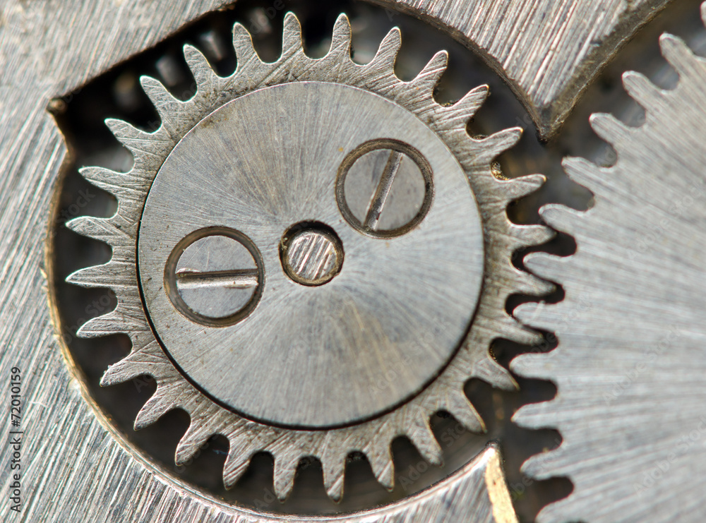 Fototapeta premium Background with metal cogwheels a clockwork in old watch.Concept